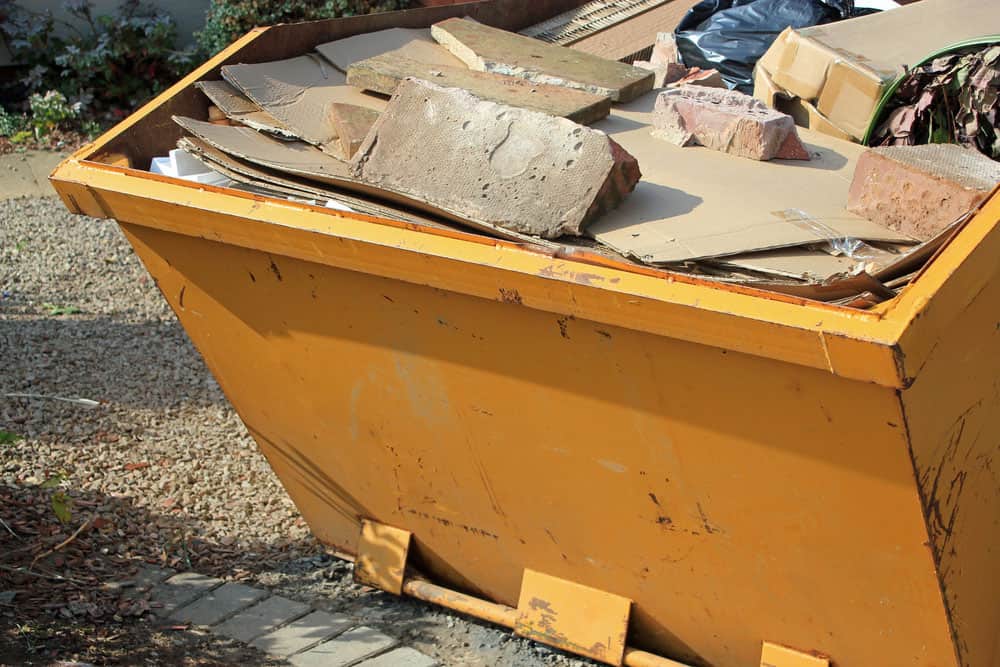 Yellow skip containing building waste
